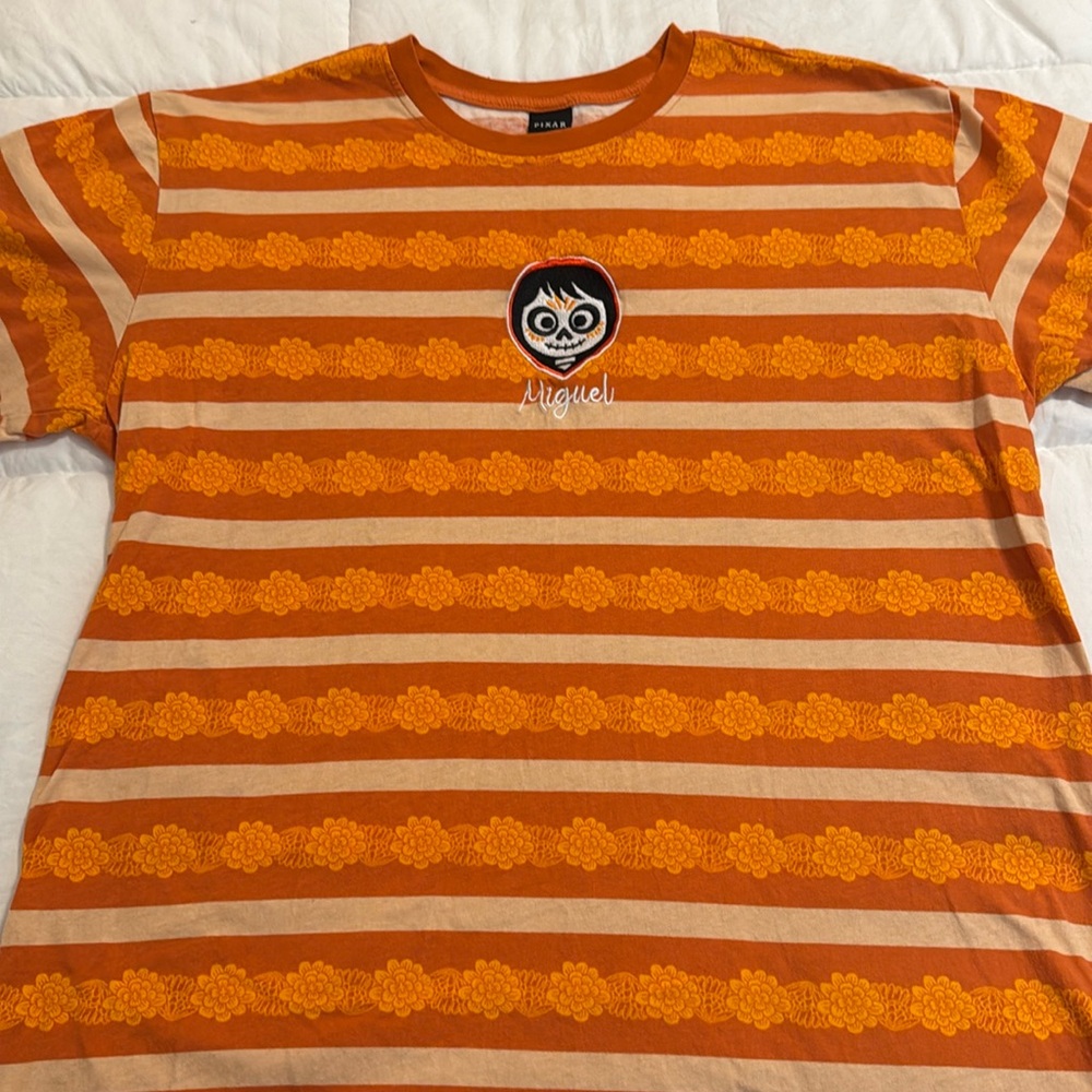 Pixar Coco Miguel Marigold all over print shirt. EUC Adults XL